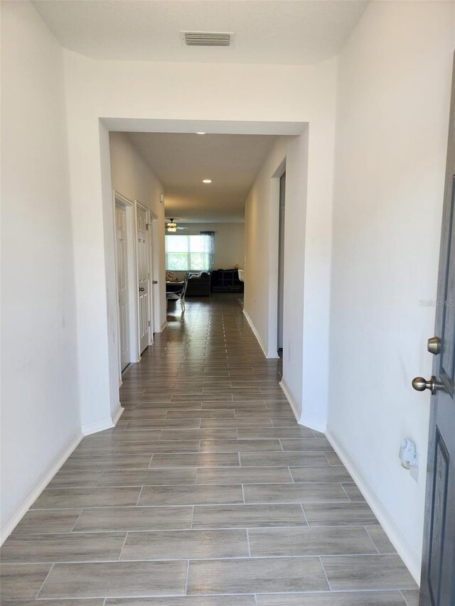 hallway featuring tile patterned floors