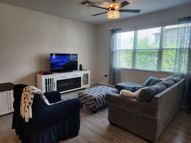 living room featuring radiator, ceiling fan, and hardwood / wood-style floors