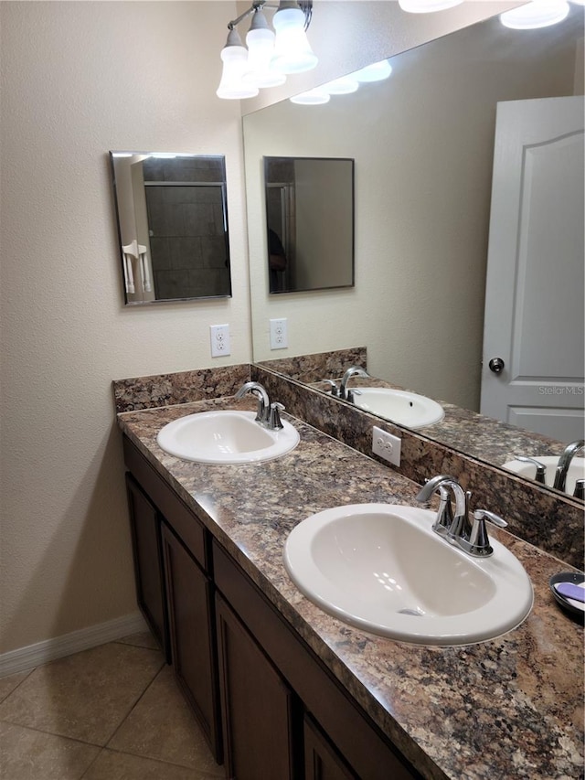 bathroom with tile floors and double vanity