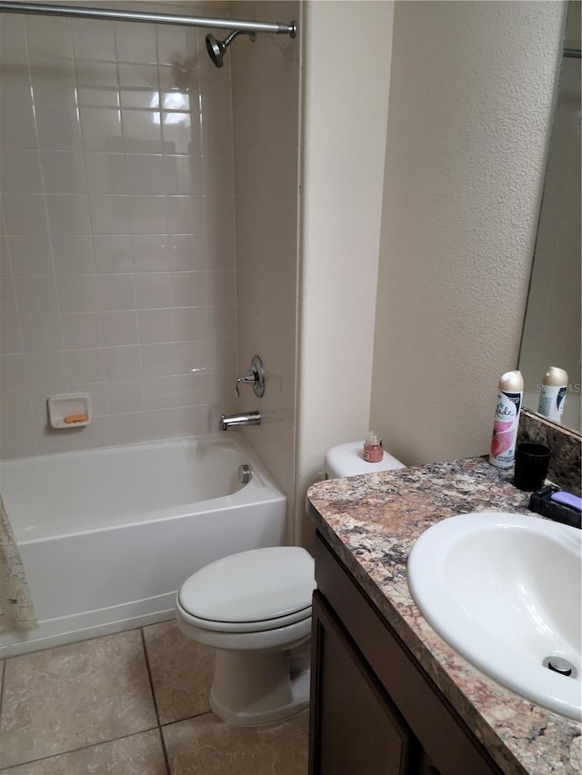 full bathroom with tile floors, toilet, vanity, and shower / bath combination