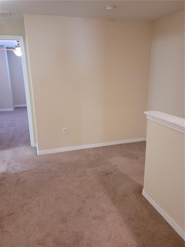 empty room featuring light colored carpet