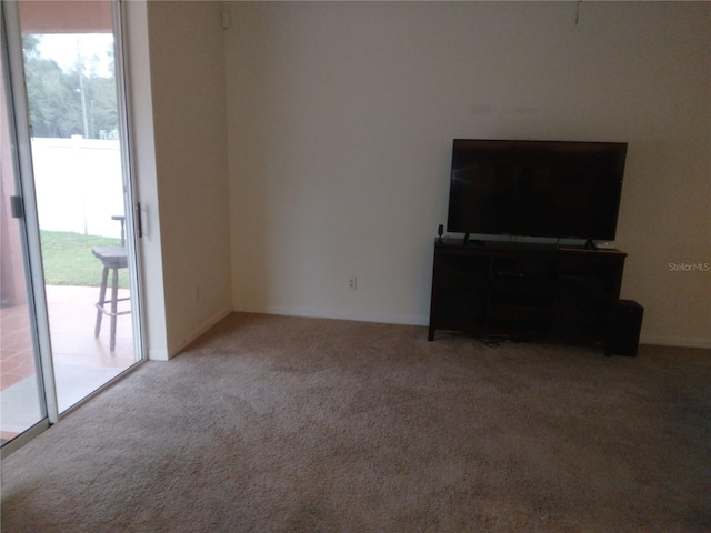 living room with plenty of natural light and light carpet