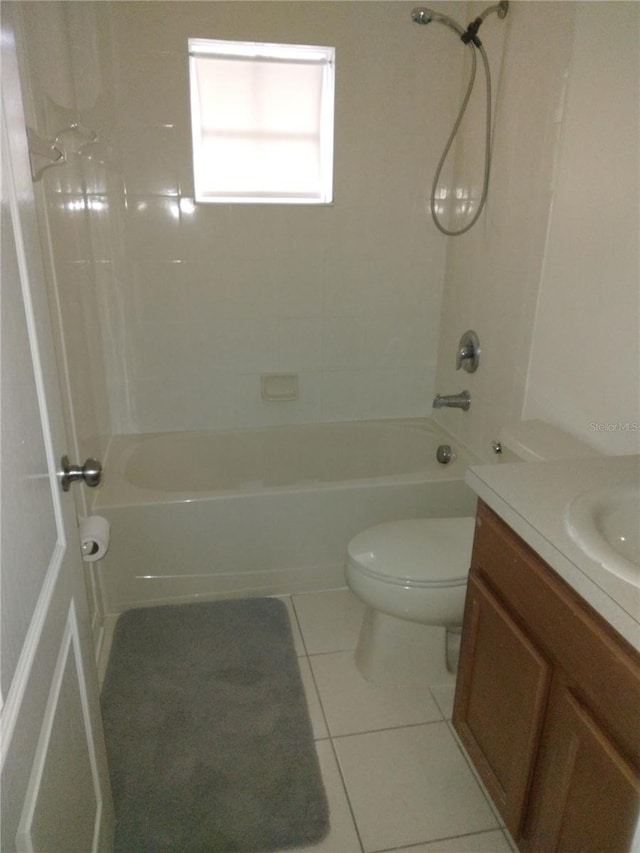 full bathroom featuring  shower combination, toilet, vanity, and tile flooring