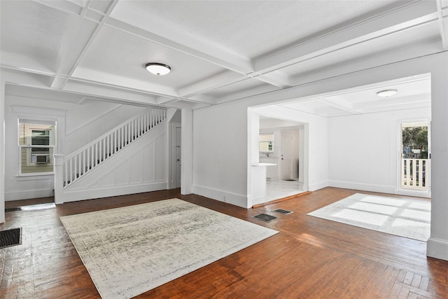 entryway with dark hardwood / wood-style floors, coffered ceiling, and beamed ceiling