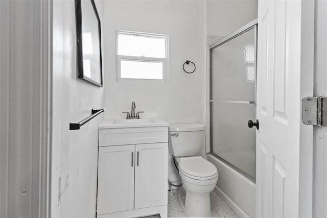 full bathroom featuring toilet, tile floors, large vanity, and shower / bath combination with glass door