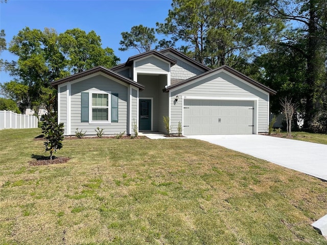 view of front of property with a front lawn and a garage