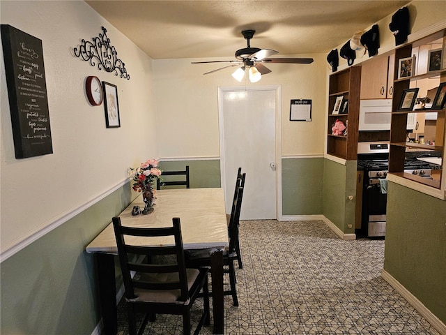 dining space featuring ceiling fan