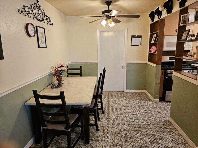 dining area with ceiling fan