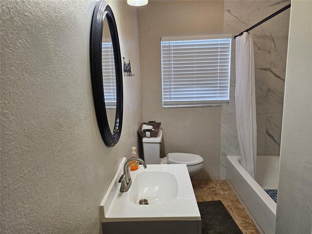 full bathroom with toilet, vanity, and shower / bath combo with shower curtain