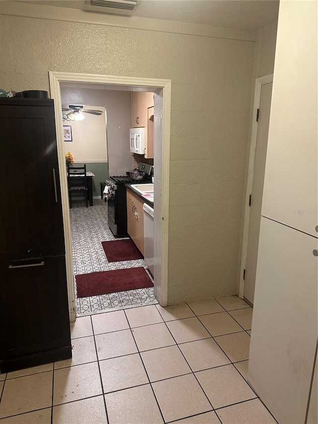 bathroom featuring tile patterned floors and ceiling fan