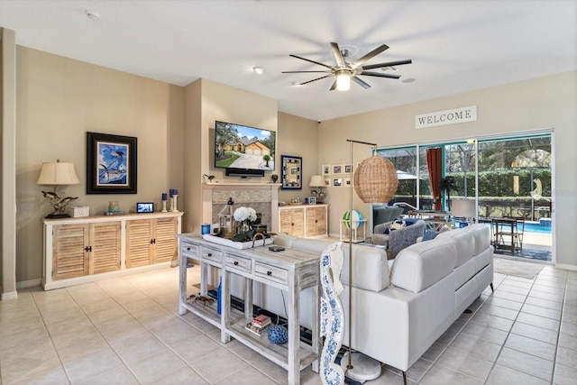 tiled living room with ceiling fan