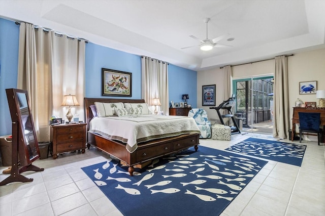 bedroom featuring light tile floors, ceiling fan, access to outside, and a raised ceiling