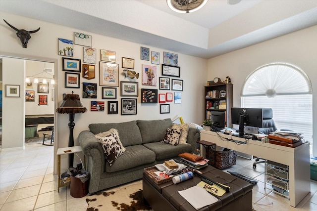 interior space featuring a tray ceiling and light tile floors