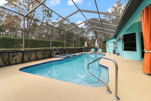 view of pool with a patio area and a lanai