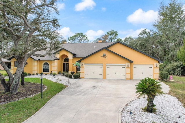 ranch-style house with a front yard and a garage