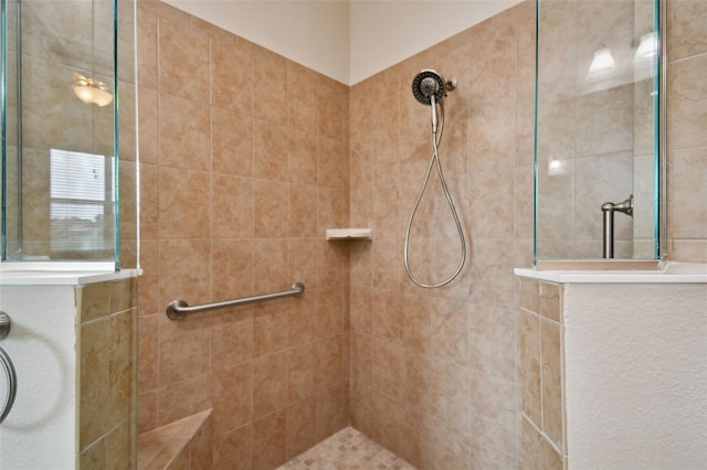 bathroom with tiled shower