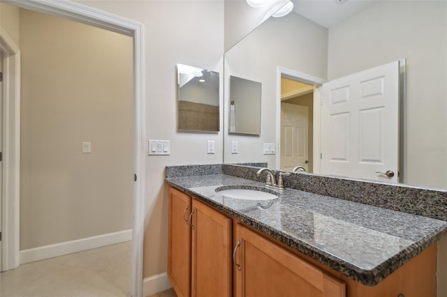 bathroom with vanity and tile patterned flooring