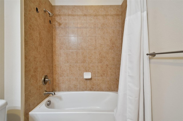 bathroom with shower / bath combo with shower curtain