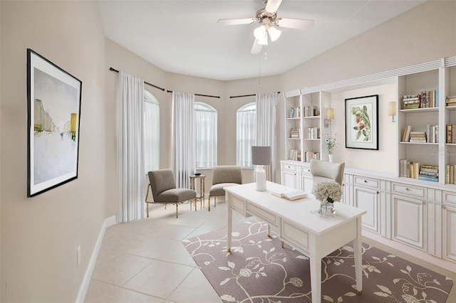 tiled office space with ceiling fan