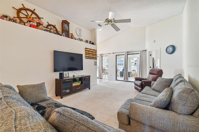 carpeted living room with high vaulted ceiling and ceiling fan