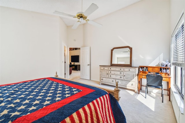 bedroom with light carpet, high vaulted ceiling, and ceiling fan