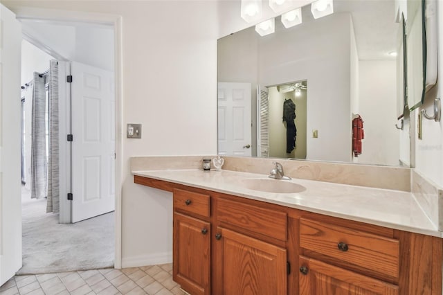 bathroom featuring tile flooring and oversized vanity