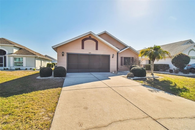 ranch-style house with a front lawn and a garage