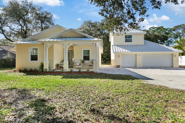 view of front of property featuring covered porch and a front yard