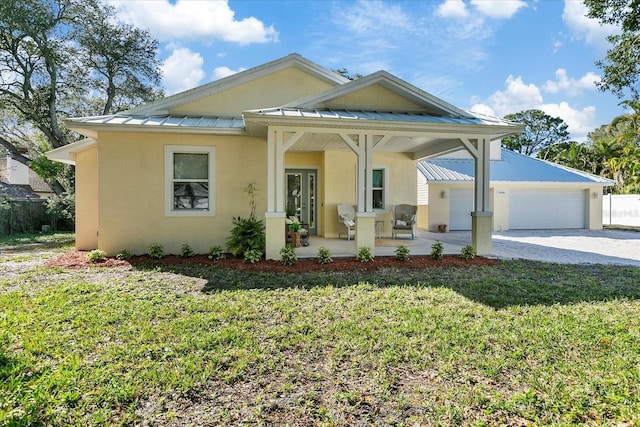 view of front of home with a garage and a front yard