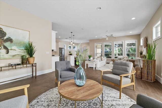 living room with ceiling fan and hardwood / wood-style flooring