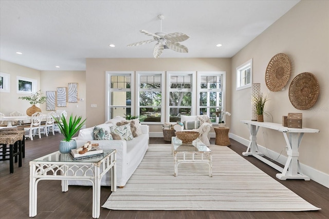 living room featuring wood-type flooring and ceiling fan