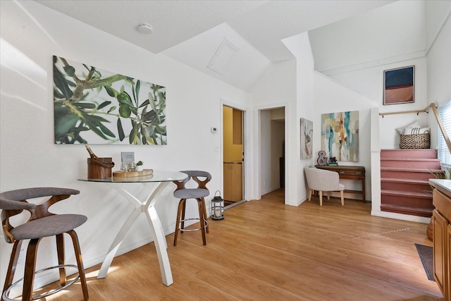 interior space with high vaulted ceiling and light hardwood / wood-style floors