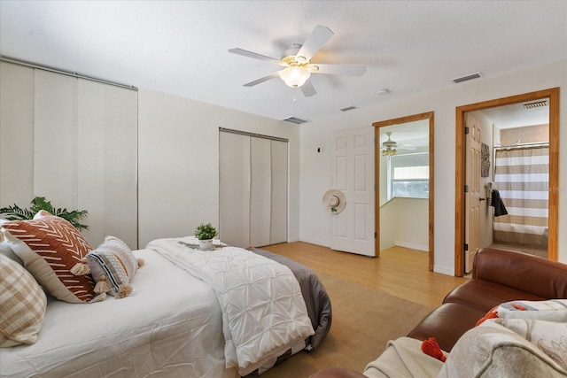 bedroom with ceiling fan and light wood-type flooring