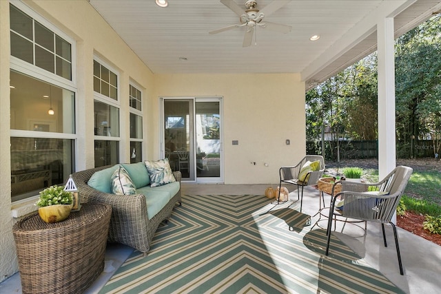 view of terrace featuring outdoor lounge area and ceiling fan