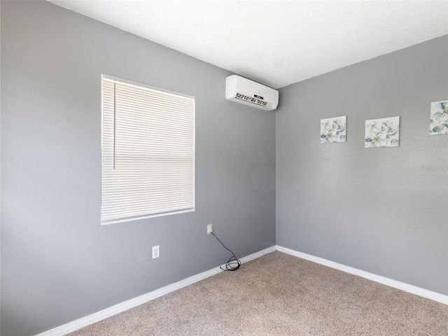 unfurnished room featuring carpet floors and a wall mounted AC