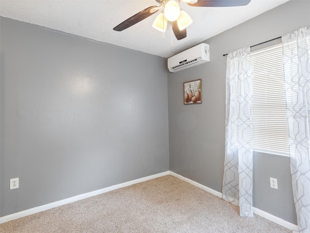 carpeted empty room featuring an AC wall unit and ceiling fan