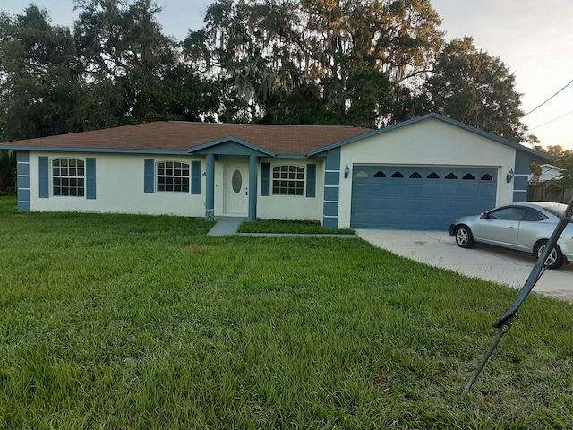 ranch-style house featuring a garage and a front lawn