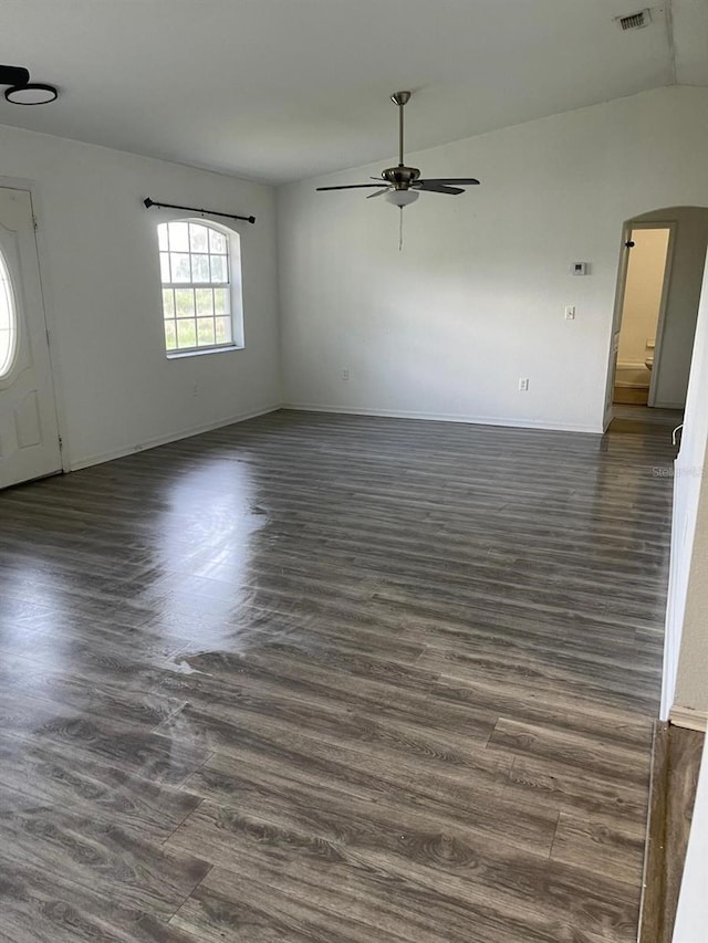 spare room with dark hardwood / wood-style floors and ceiling fan