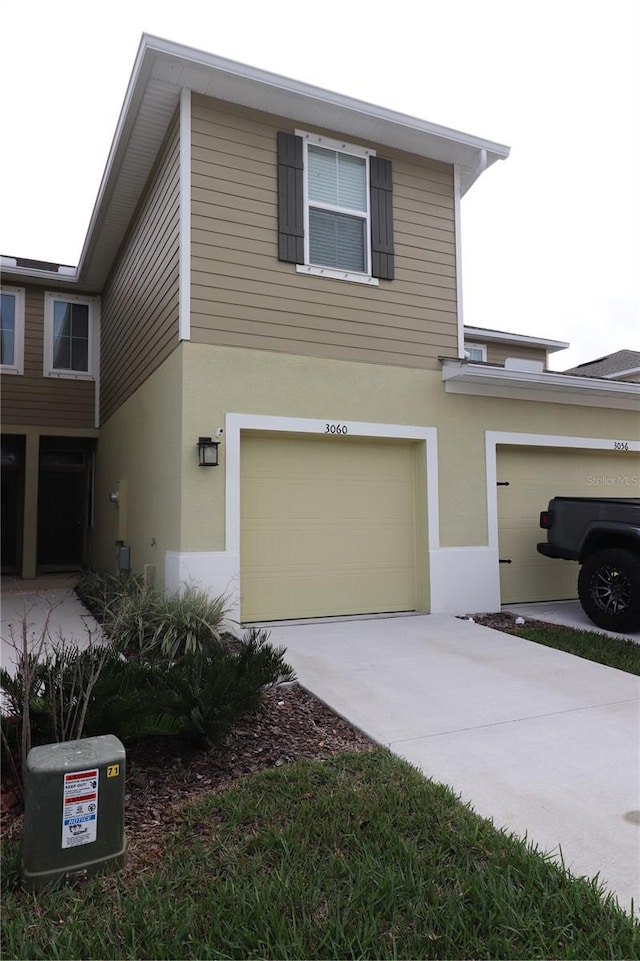 view of side of home with a garage