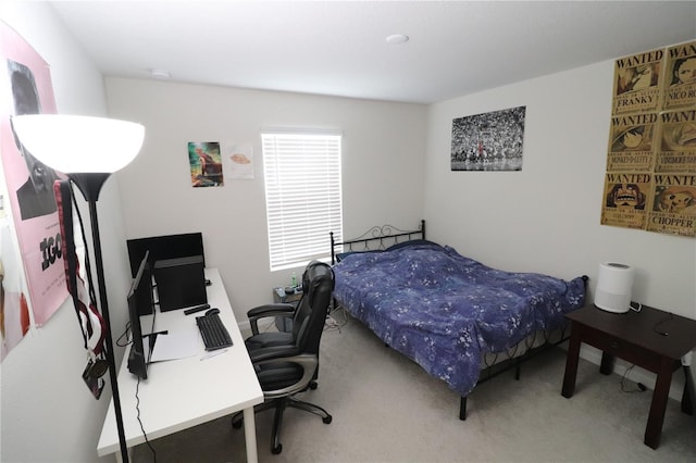 bedroom featuring light carpet