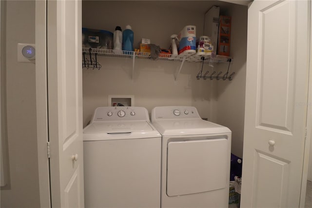 washroom with hookup for a washing machine and separate washer and dryer