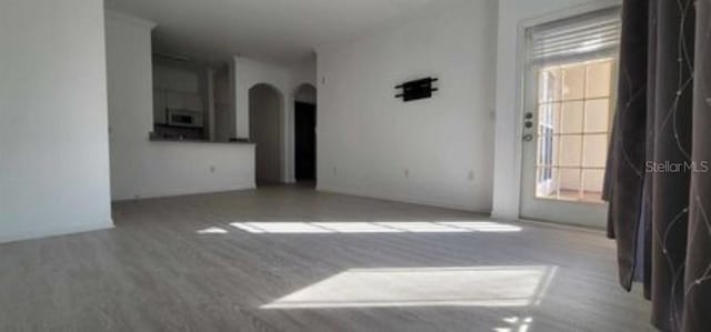 spare room with light wood-type flooring