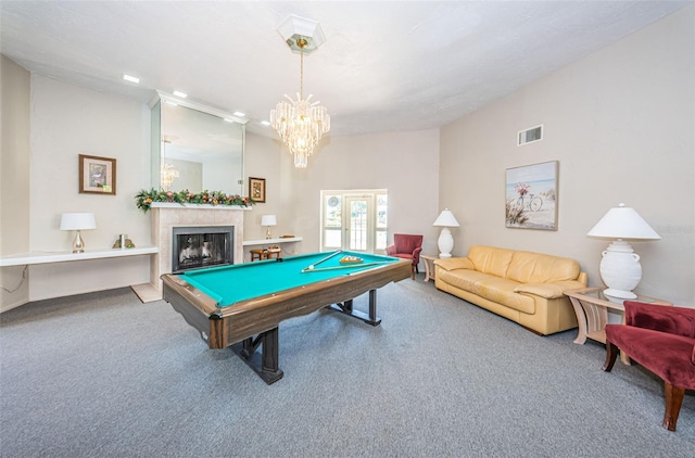 rec room featuring light carpet, billiards, and a notable chandelier