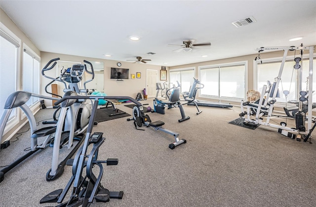 workout area with carpet and ceiling fan