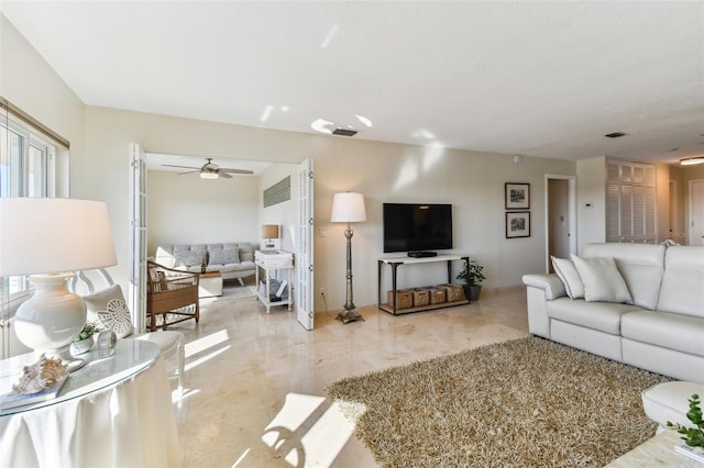 living room featuring ceiling fan