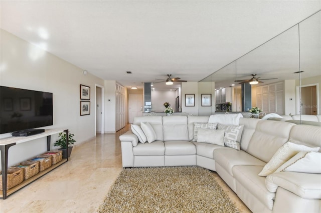 living room featuring ceiling fan