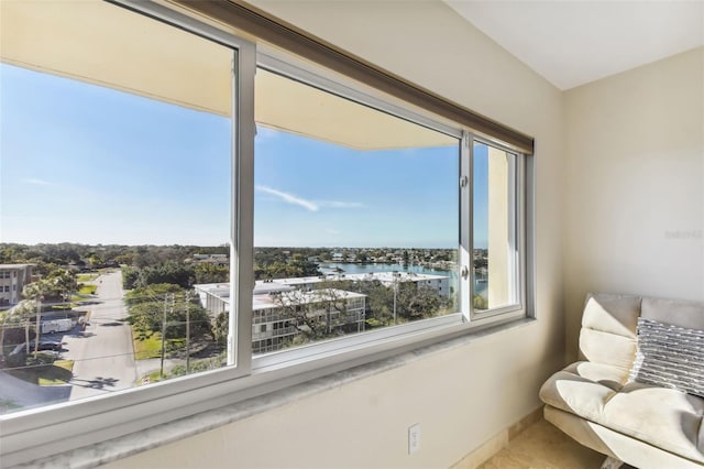 unfurnished room with a water view