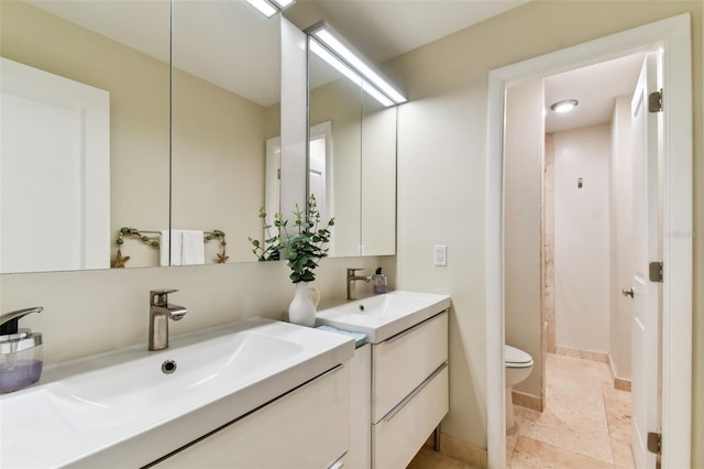 bathroom featuring vanity, toilet, and curtained shower