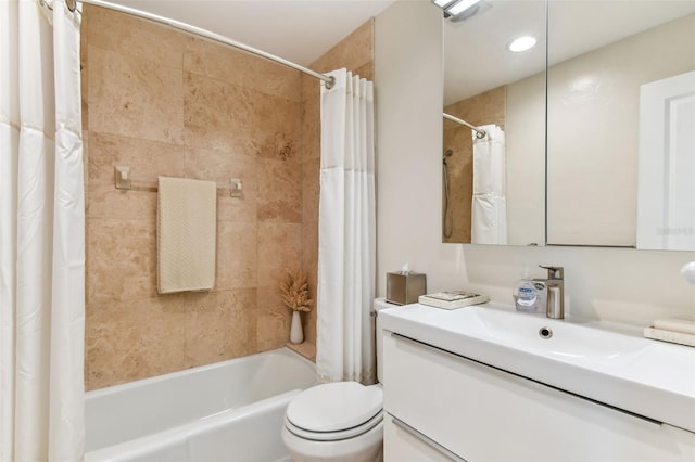 full bathroom featuring shower / bath combination with curtain, vanity, and toilet