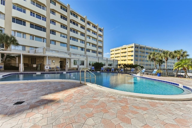 view of swimming pool with a patio